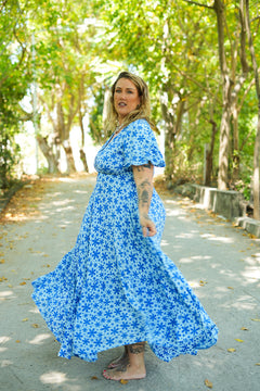 Shop the Mary Maxi Dress in Blue Floral Magic, with butterfly sleeves, deep V-neck and a flowing full-circle skirt. Handmade in Bali by Jinx the Label.