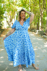 Shop the Mary Maxi Dress in Blue Floral Magic, with butterfly sleeves, deep V-neck and a flowing full-circle skirt. Handmade in Bali by Jinx the Label.