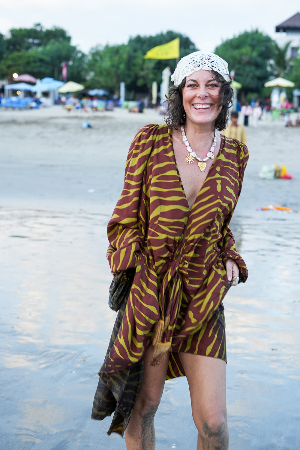 Meet the Melissa Dress in Zebra Yellow. A flowing rayon maxi with dramatic long sleeves, deep V-neck, gathered waist and tassel detail. Handmade in Bali.