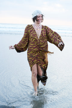 Meet the Melissa Dress in Zebra Yellow. A flowing rayon maxi with dramatic long sleeves, deep V-neck, gathered waist and tassel detail. Handmade in Bali.