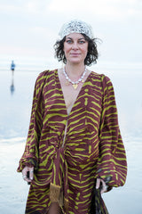 Meet the Melissa Dress in Zebra Yellow. A flowing rayon maxi with dramatic long sleeves, deep V-neck, gathered waist and tassel detail. Handmade in Bali.