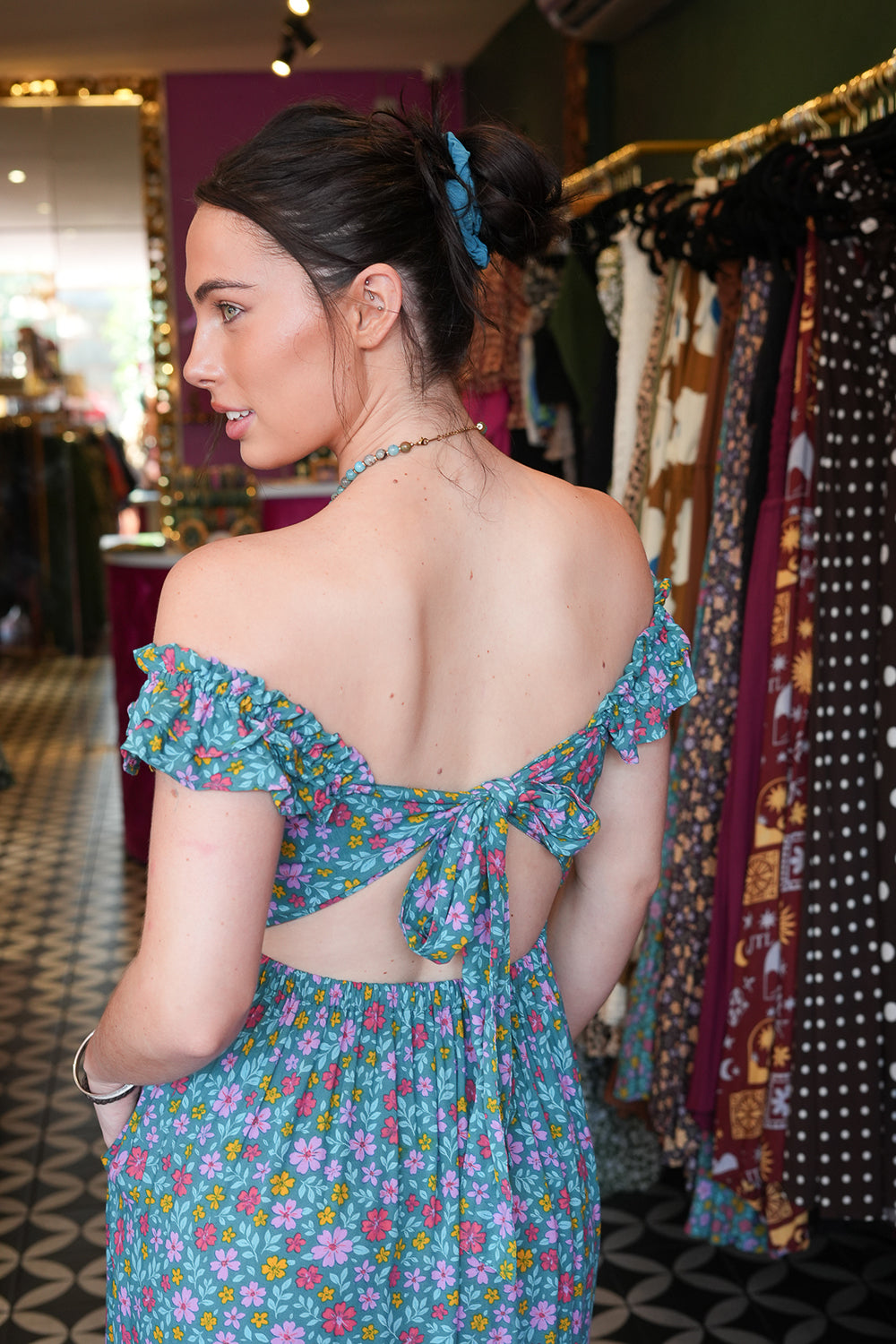 Meet the Mina Maxi Dress in Aqua Moon. A romantic rayon maxi with shirred bodice, off-shoulder ruffles, open tie back, pockets and flowing tiers.