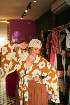 Meet the Miranda Wrap Top in Wildflower. A bohemian wrap top with dramatic wide sleeves, crochet trim and our bold floral print. Handmade in Bali.