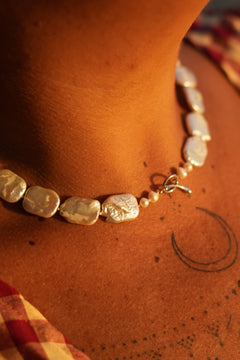 Discover the Moon Tide Necklace in Lunar Pearl, with irregular natural pearls and a gold toned toggle closure from Earth Altering by Jinx the Label.