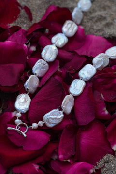 Discover the Moon Tide Necklace in Lunar Pearl, with irregular natural pearls and a gold toned toggle closure from Earth Altering by Jinx the Label.