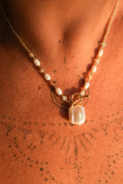 Shop the Moonwater Necklace in Pearl Gold, with delicate beads, organic pearls, gold toggle and a baroque pearl pendant from Earth Altering by Jinx the Label.