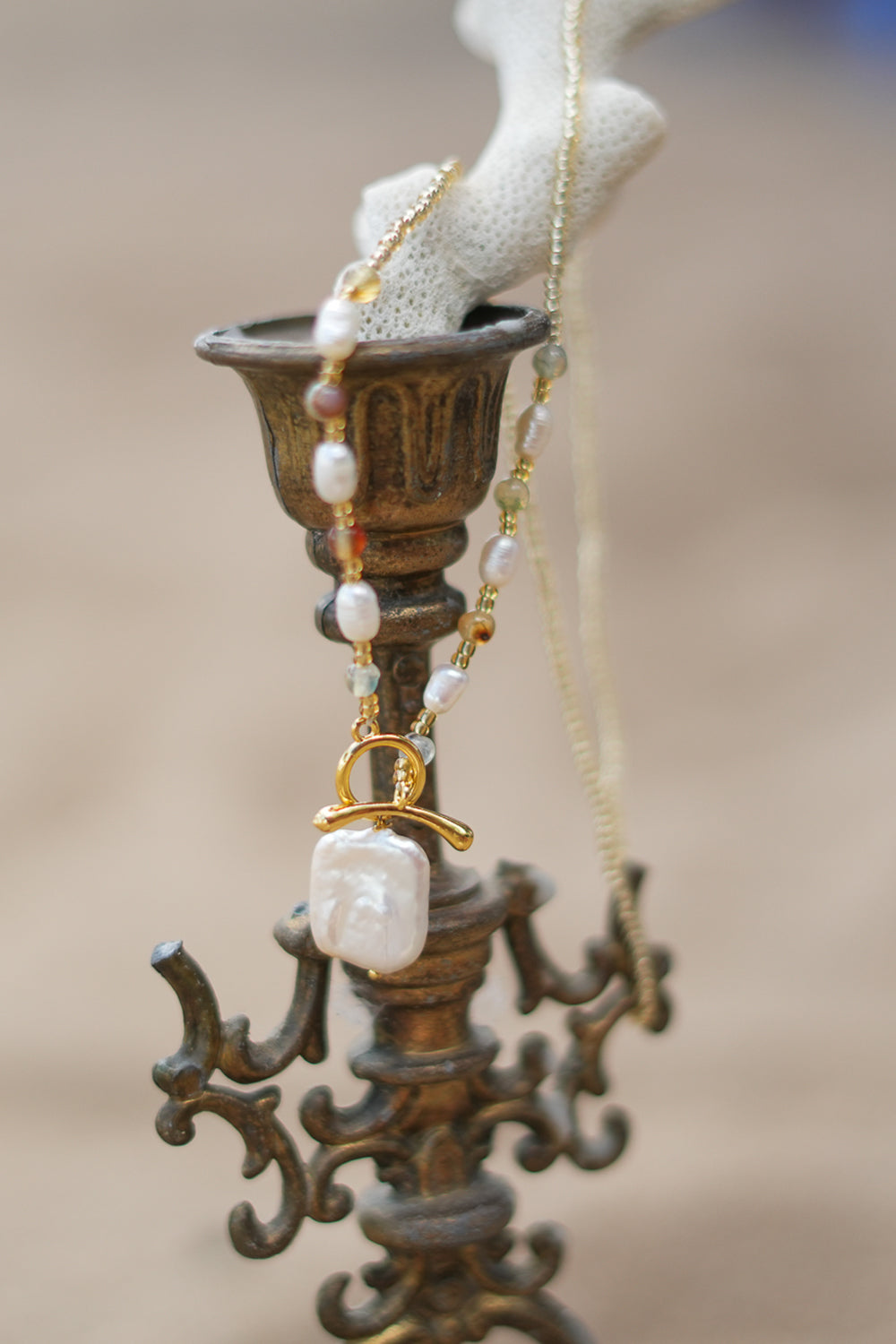 Shop the Moonwater Necklace in Pearl Gold, with delicate beads, organic pearls, gold toggle and a baroque pearl pendant from Earth Altering by Jinx the Label.