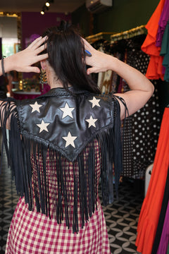 Meet the Nevada Cape in Black, handcrafted from genuine leather with cascading fringe, Western styling and contrast stars. A true Jinx the Label statement piece.