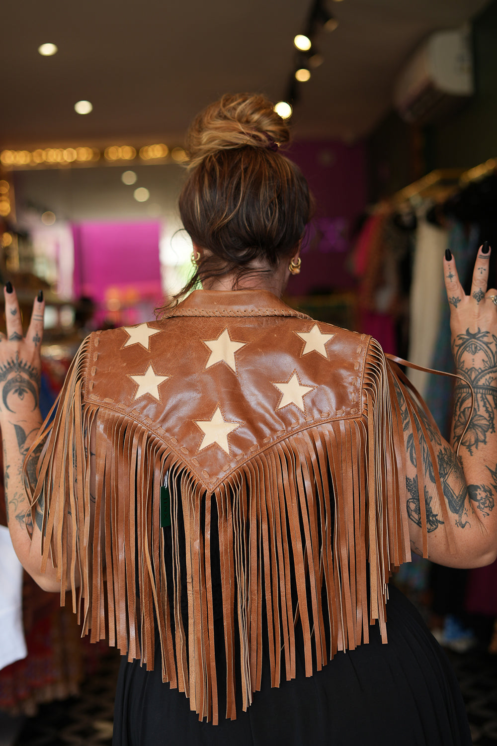 Meet the Nevada Cape in Brown, handcrafted from 100% genuine leather with cascading fringe, Western detailing and statement stars. Handmade with love.