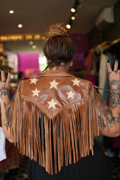 Meet the Nevada Cape in Brown, handcrafted from 100% genuine leather with cascading fringe, Western detailing and statement stars. Handmade with love.
