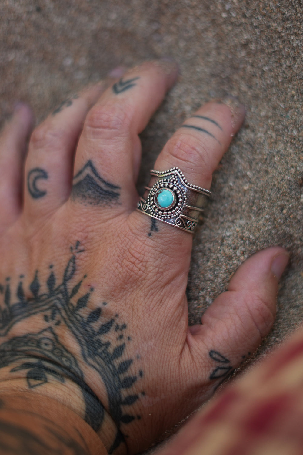Discover the Nomad Ring by Jinx the Label, a statement sterling silver ring featuring natural turquoise, intricate scrollwork and bohemian detailing.