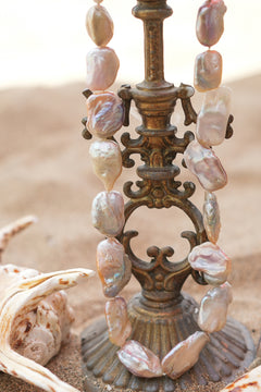 Discover the Ocean Relic Necklace in Wild Pearl, crafted with large freeform natural pearls, each uniquely shaped by nature. Earth Altering by Jinx the Label.