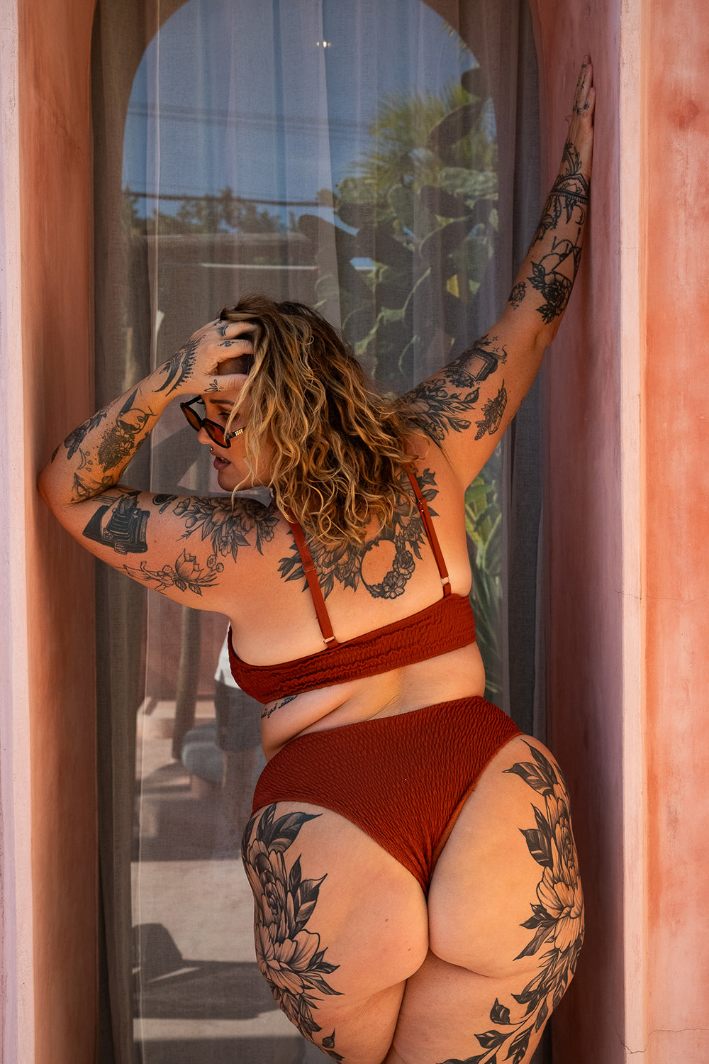 The Starlet Top in Burnt Orange by Jinx the Label. Handmade in Bali with premium shirred swim fabric, adjustable straps and inclusive sizing.