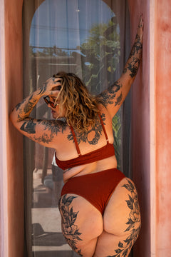 The Starlet Top in Burnt Orange by Jinx the Label. Handmade in Bali with premium shirred swim fabric, adjustable straps and inclusive sizing.