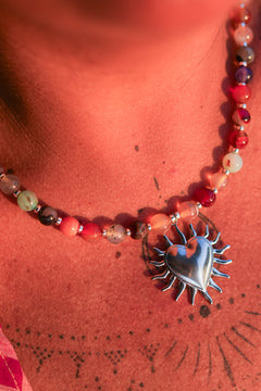 Meet the Sacred Flame Necklace in Wild Ember, with colorful natural stone beads and a statement silver heart pendant from Earth Altering by Jinx the Label.