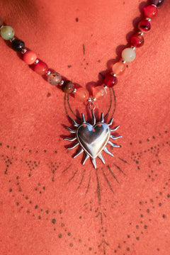 Meet the Sacred Flame Necklace in Wild Ember, with colorful natural stone beads and a statement silver heart pendant from Earth Altering by Jinx the Label.