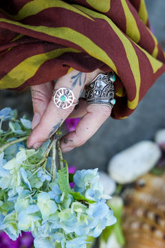 Discover the Solara Ring by Jinx the Label, a sterling silver sun inspired ring featuring a natural turquoise centre stone and delicate bohemian detailing.