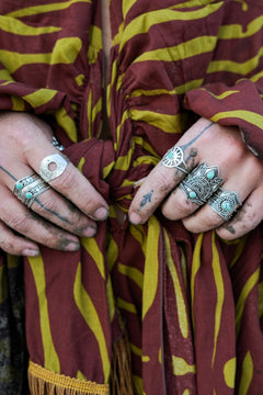 Discover the Solara Ring by Jinx the Label, a sterling silver sun inspired ring featuring a natural turquoise centre stone and delicate bohemian detailing.
