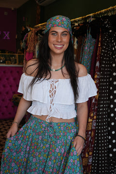 Meet our Bandana in Aqua Bloom from Nevada. Handmade in Bali from leftover rayon fabric, this versatile accessory adds a playful finishing touch to any look.