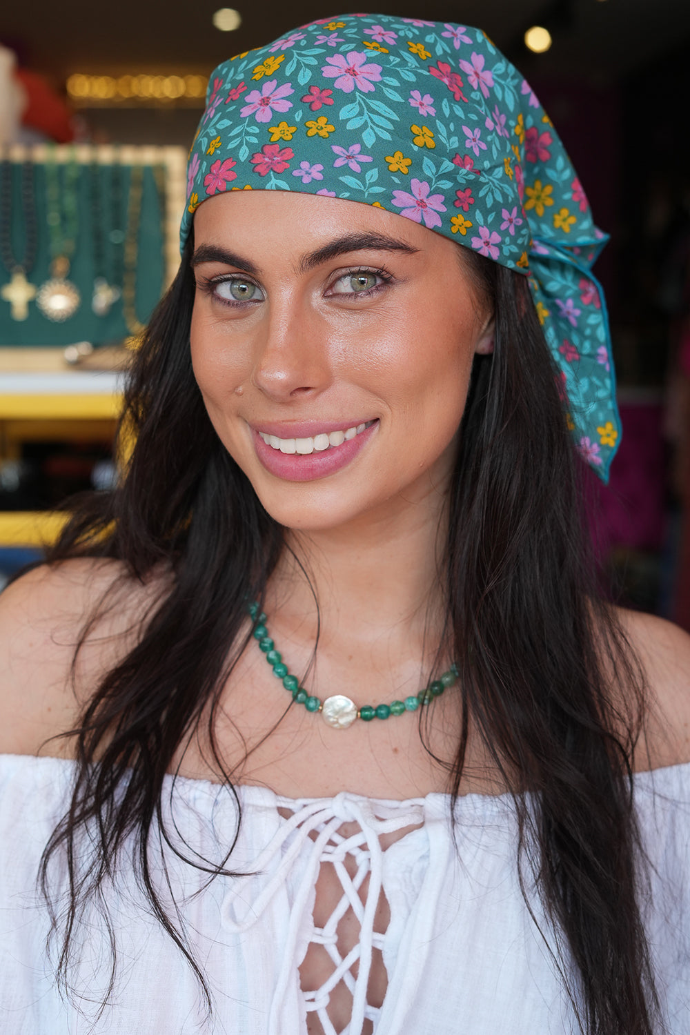 Meet our Bandana in Aqua Bloom from Nevada. Handmade in Bali from leftover rayon fabric, this versatile accessory adds a playful finishing touch to any look.