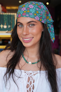 Meet our Bandana in Aqua Bloom from Nevada. Handmade in Bali from leftover rayon fabric, this versatile accessory adds a playful finishing touch to any look.