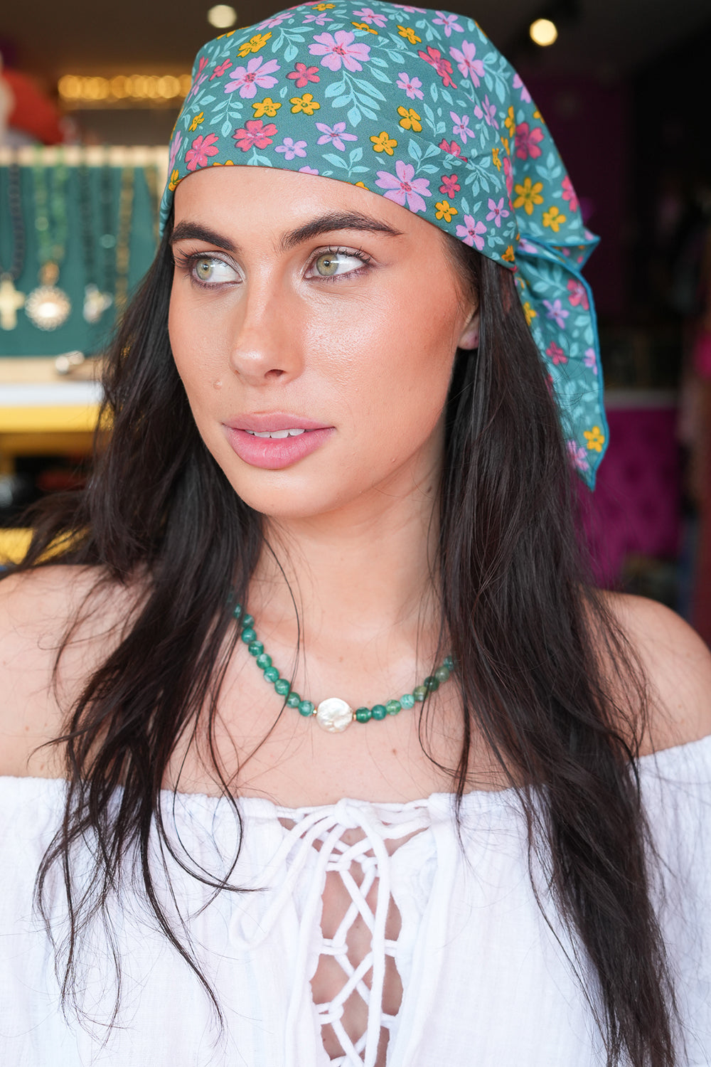 Meet our Bandana in Aqua Bloom from Nevada. Handmade in Bali from leftover rayon fabric, this versatile accessory adds a playful finishing touch to any look.