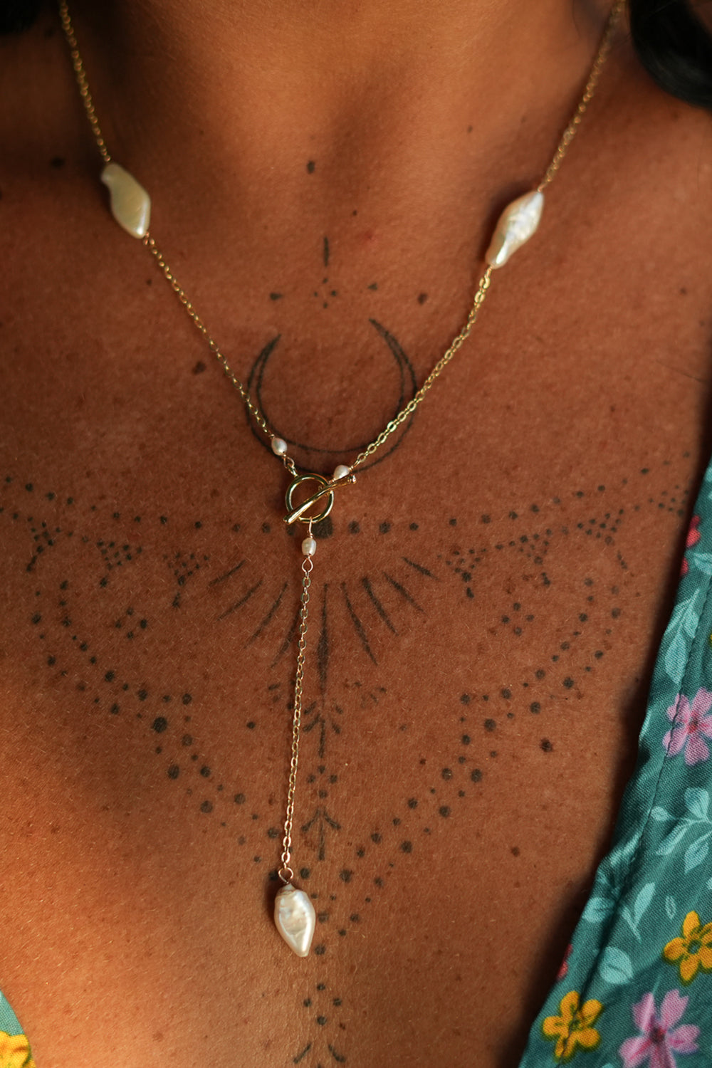 Shop the Tidal Lariat Necklace in Pearl Gold, featuring organic baroque pearls, fine gold chain and an elegant drop from Earth Altering by Jinx the Label.