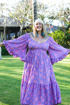 Meet the Tina Maxi Dress in Sugarmoon. A dreamy floral rayon maxi with a shirred waist, dramatic bell sleeves and flowing bohemian silhouette.