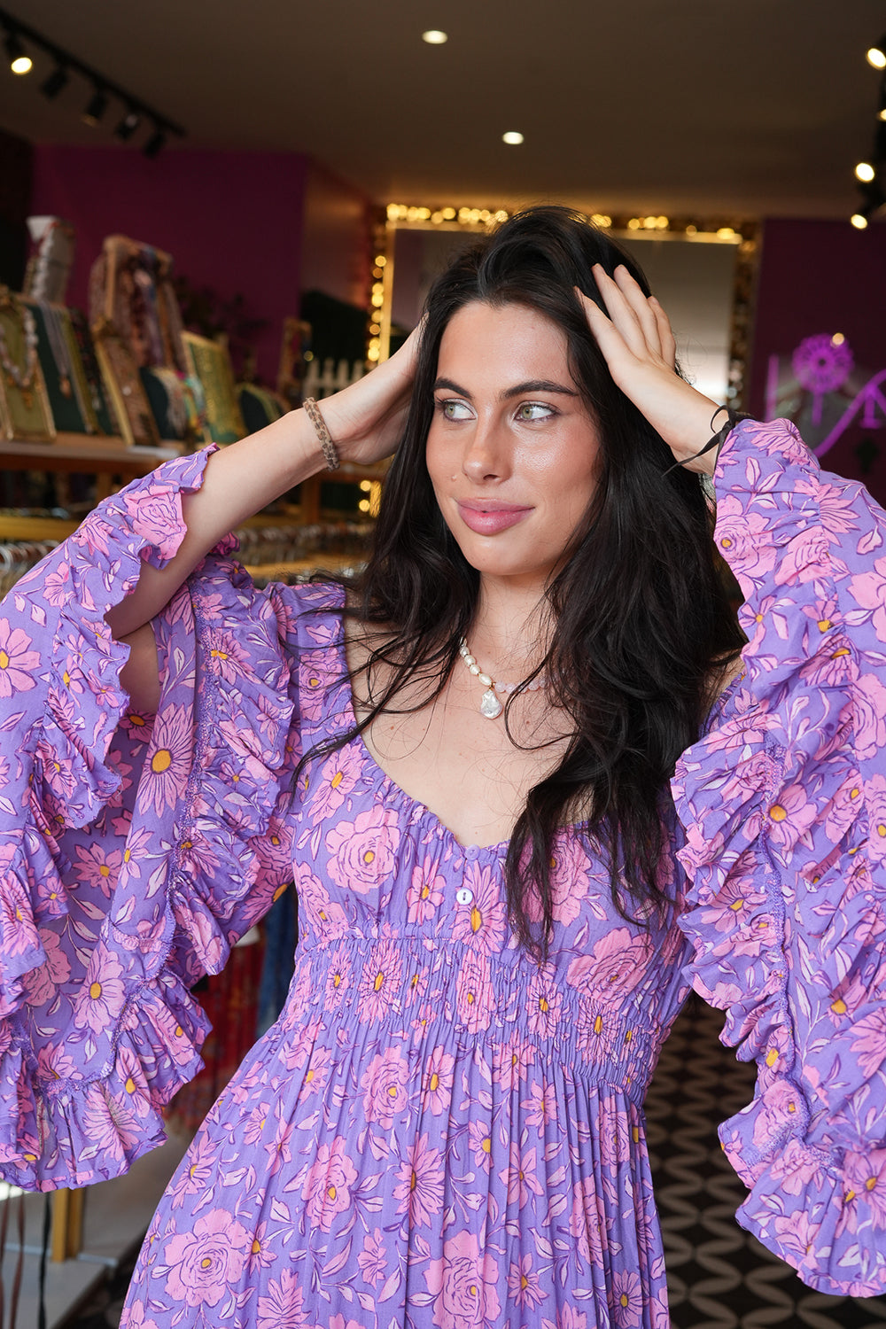 Meet the Tina Maxi Dress in Sugarmoon. A dreamy floral rayon maxi with a shirred waist, dramatic bell sleeves and flowing bohemian silhouette.