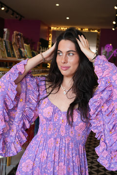 Meet the Tina Maxi Dress in Sugarmoon. A dreamy floral rayon maxi with a shirred waist, dramatic bell sleeves and flowing bohemian silhouette.