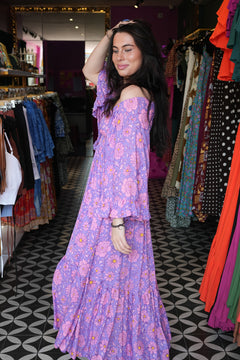 Meet the Tina Maxi Dress in Sugarmoon. A dreamy floral rayon maxi with a shirred waist, dramatic bell sleeves and flowing bohemian silhouette.