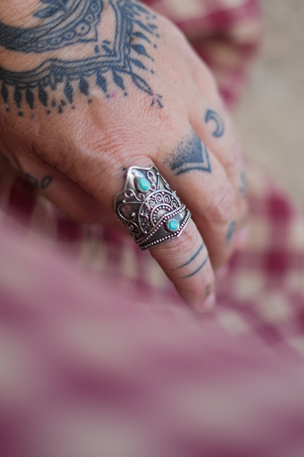 Discover the Wanderer Ring by Jinx the Label, an ornate sterling silver statement ring featuring natural turquoise stones and intricate bohemian detailing.