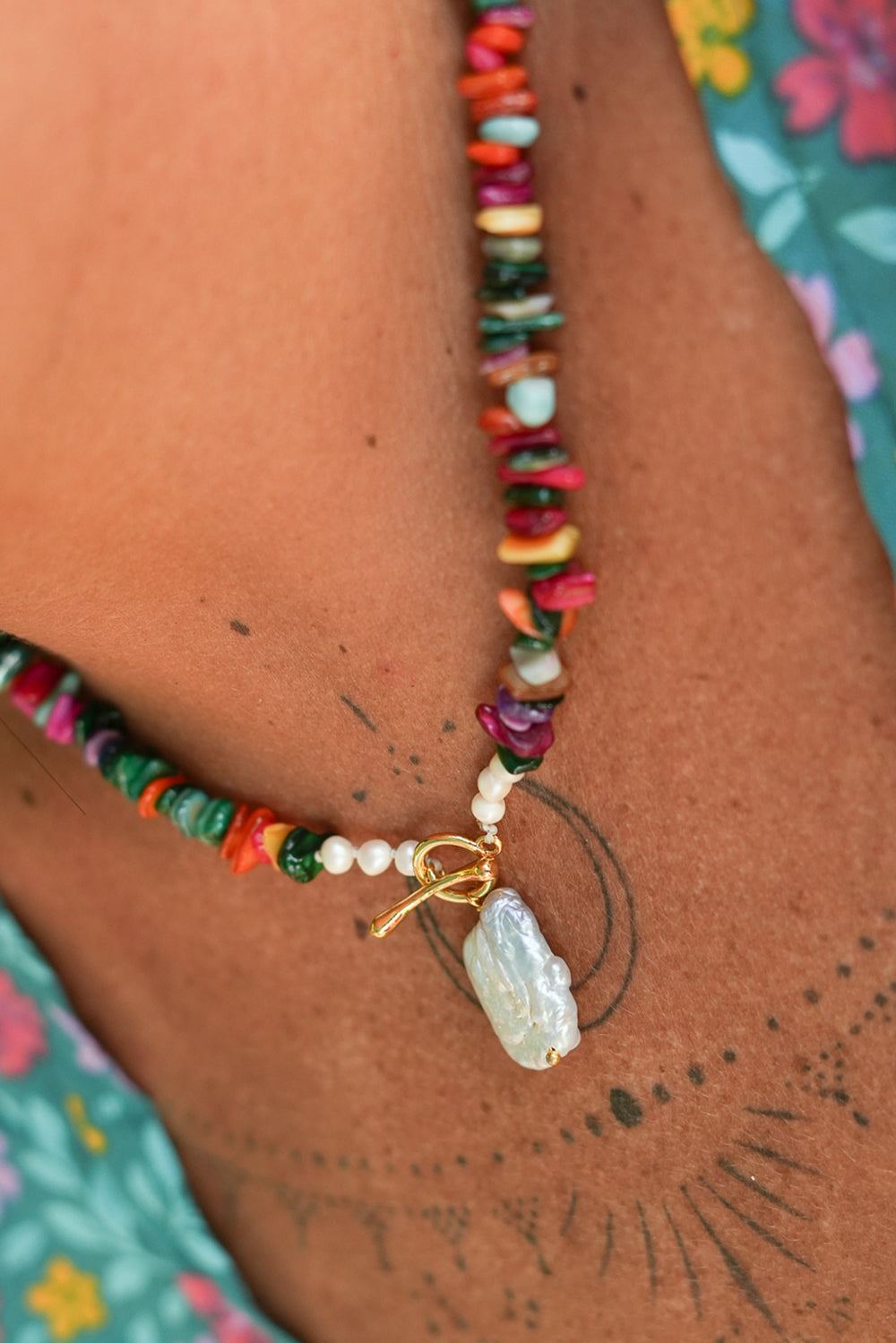 Shop the Wanderlust Necklace in Rainbow Pearl, with colorful chip beads, creamy pearls and a baroque pearl pendant from Earth Altering by Jinx the Label.
