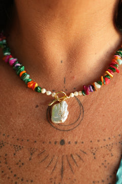 Shop the Wanderlust Necklace in Rainbow Pearl, with colorful chip beads, creamy pearls and a baroque pearl pendant from Earth Altering by Jinx the Label.