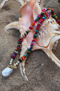 Shop the Wanderlust Necklace in Rainbow Pearl, with colorful chip beads, creamy pearls and a baroque pearl pendant from Earth Altering by Jinx the Label.