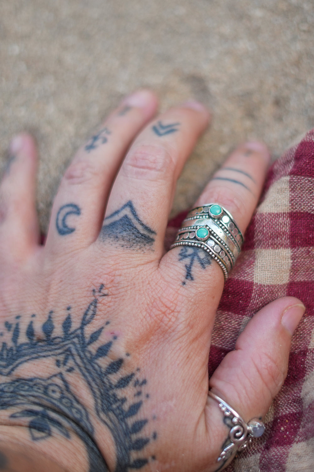 Discover the Wayfarer Ring by Jinx the Label, a wide sterling silver statement ring featuring two natural turquoise stones and intricate bohemian detailing.