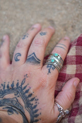 Discover the Wayfarer Ring by Jinx the Label, a wide sterling silver statement ring featuring two natural turquoise stones and intricate bohemian detailing.