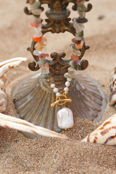 Discover the Wild Earth Necklace in Desert Bloom, with natural stone chips, freshwater pearls and a statement pearl pendant from Earth Altering by Jinx the Label.