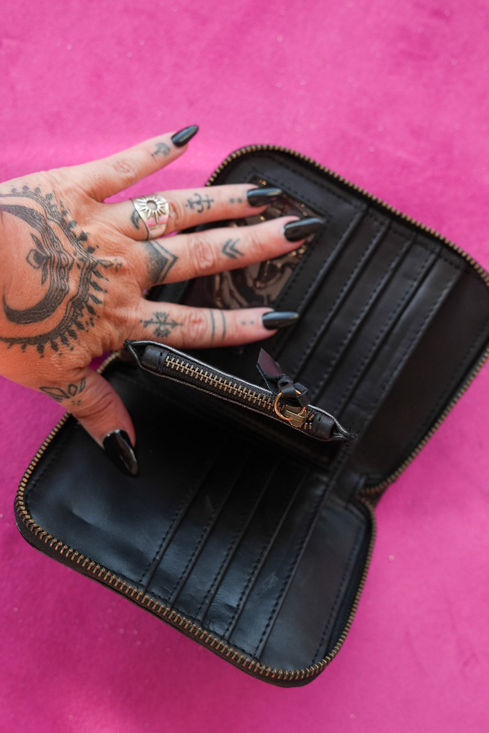 Meet the Wildheart Wallet in Burnished Espresso. A handcrafted leather zip wallet with hand tooled motives, card slots, a coin compartment and leather tassel.