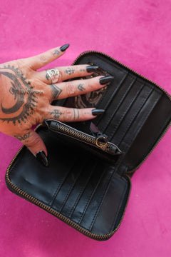 Meet the Wildheart Wallet in Burnished Espresso. A handcrafted leather zip wallet with hand tooled motives, card slots, a coin compartment and leather tassel.